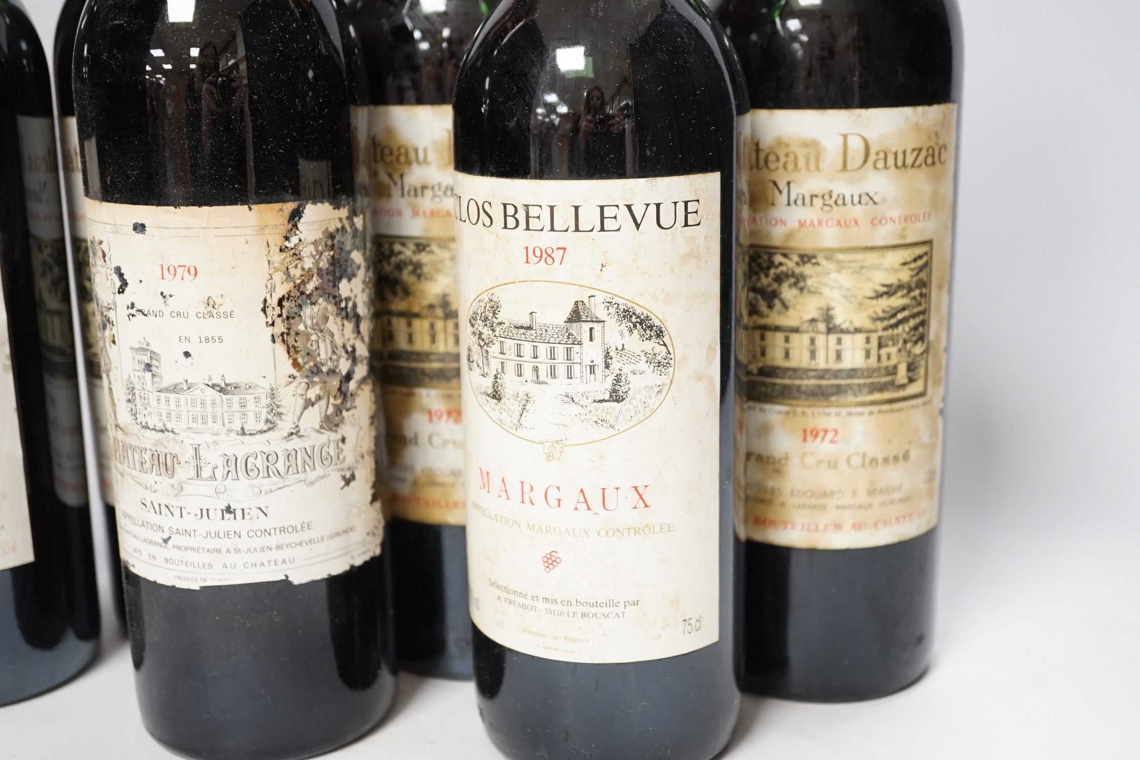 Three bottles of Chateau Dauzac Margaux 1972 and three other bottles Chateau Du Glana Saint Julien 1978, Chateau Lagrange Saint Julien 1979 and Clos Bellevue Margaux 1987